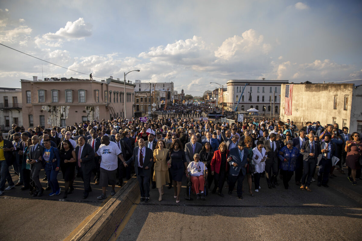 U.S. Vice President Kamala Harris joins Civil Rights leaders and other guests as they walk across the Edmund Pettus Bridge during the “Bloody Sunday” commemorations in Selma, Alabama, U.S. March 6, 2022.