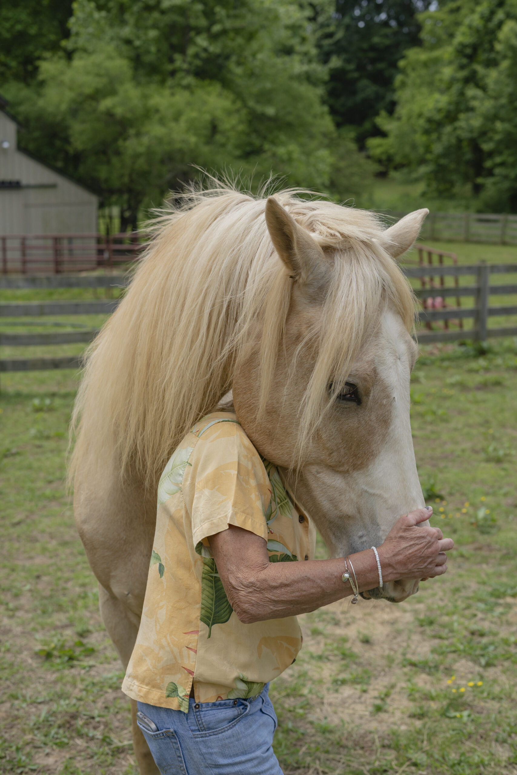 Sherrie Foy caring for her horses at her home in Moneta, Virginia, May 16, 2022. Foy had her colon removed at the University of Virginia's Health System in 2016. She later developed a dangerous infection from the surgery and her medical bills exceeded her insurance limit of $1 million. When she and her husband couldn't pay her bills, the University of Virginia sued her for more than $700,000, forcing her and her husband to file for bankruptcy.