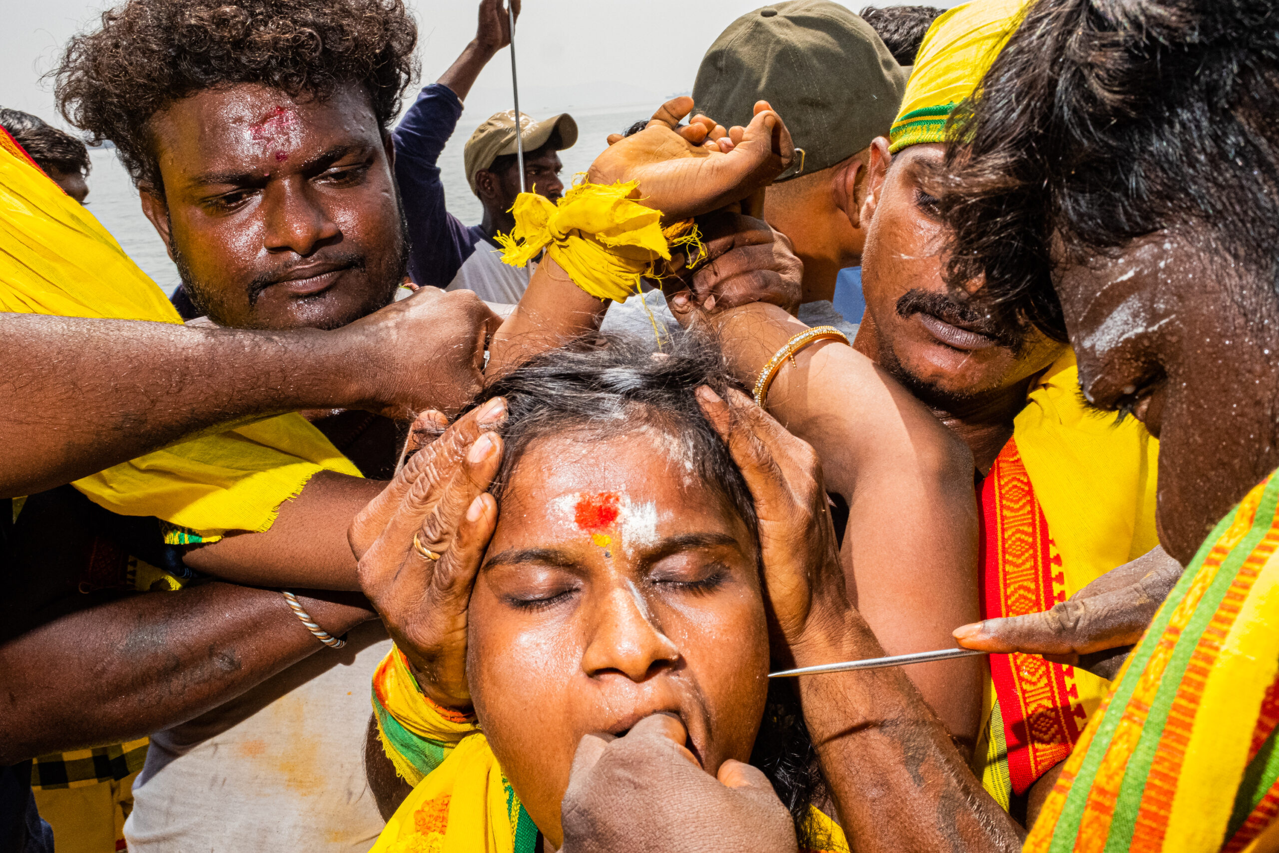 During Chitra Purnima, an important religious day for the Tamil community, several rituals take place. In one of them, devotees go into trance, channeling the Goddess in them, and have their cheeks pierced as a sign of devotion. This picture was taken in one of the small Tamil community pockets in the East coast of Mumbai.